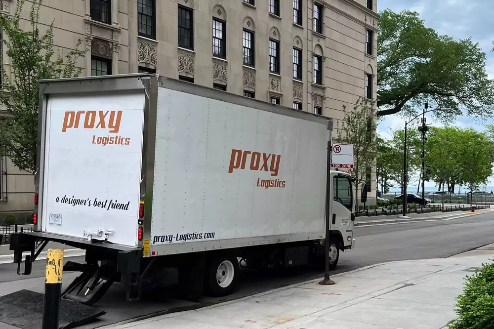 Proxy Logistics delivery truck navigating through city streets.